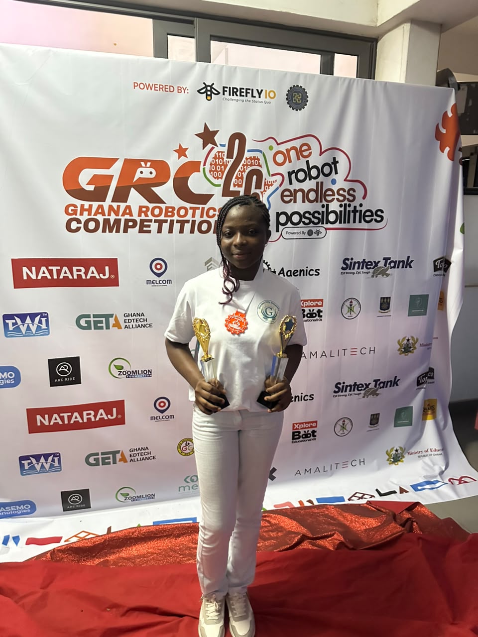 Team GCU member on the red carpet with trophies at GRC 2026